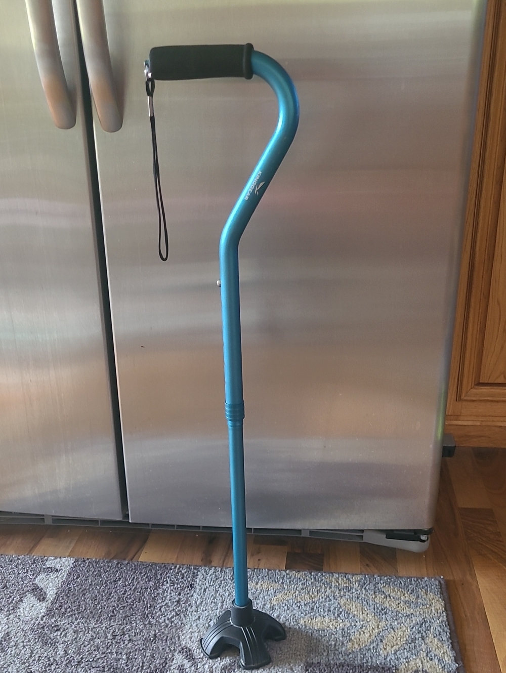Adjustable Blue Walking Cane with Comfort Grip and Quad Base